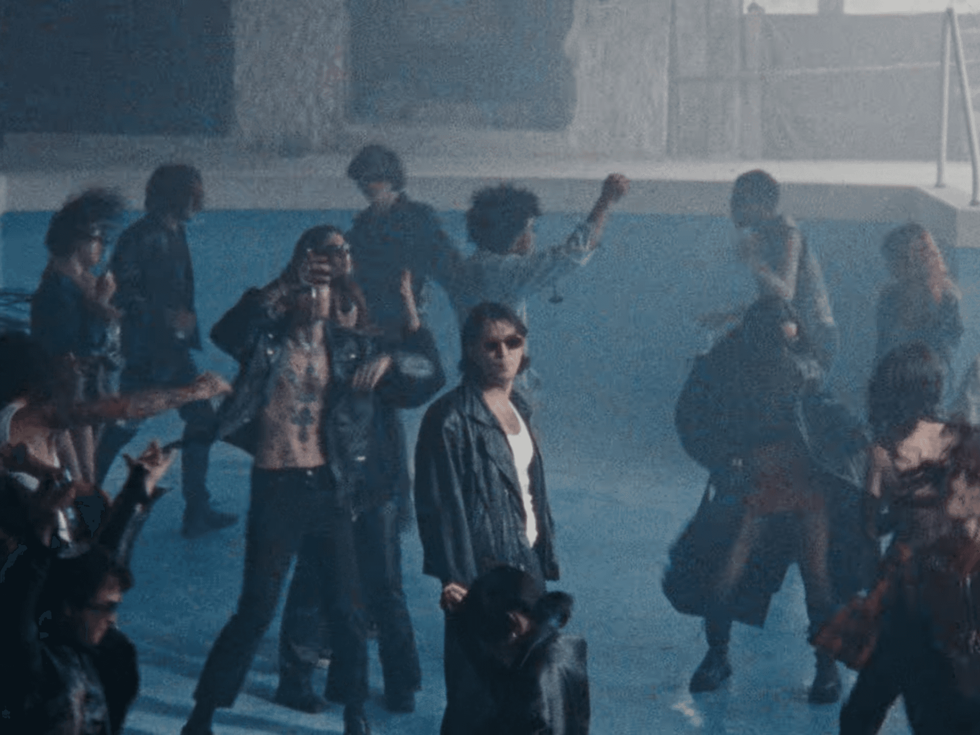 BIBIZA standing in an empty pool with other people