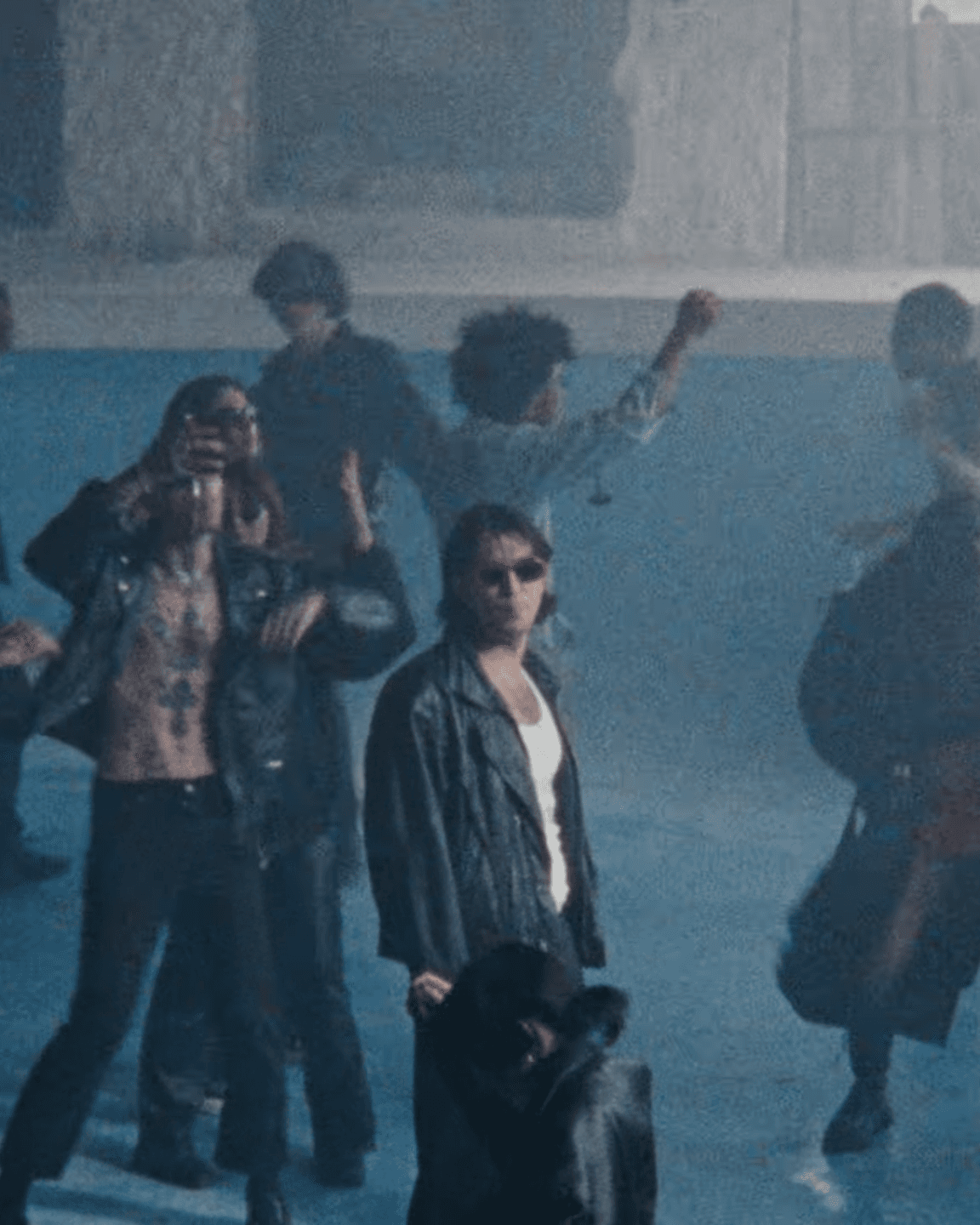 BIBIZA standing in an empty pool with other people