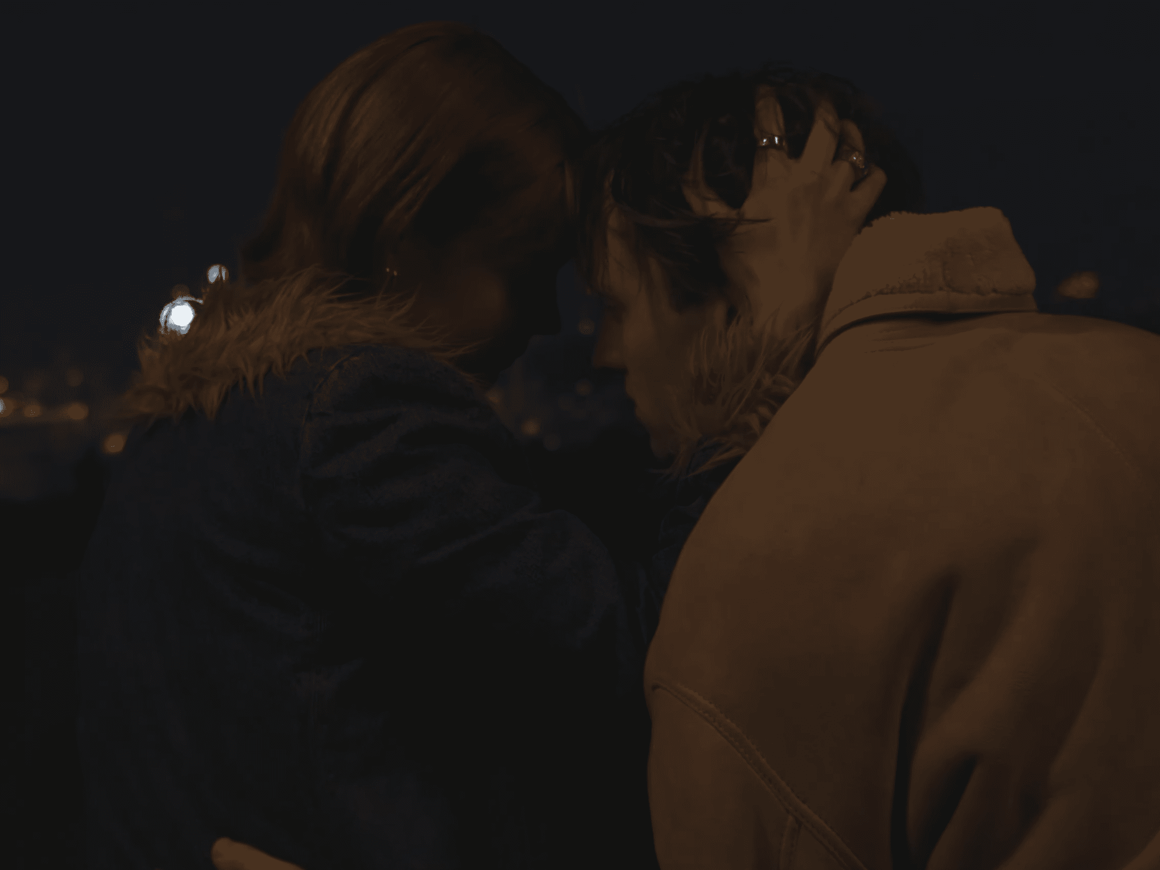 A Man and a Woman sitting on a rooftop