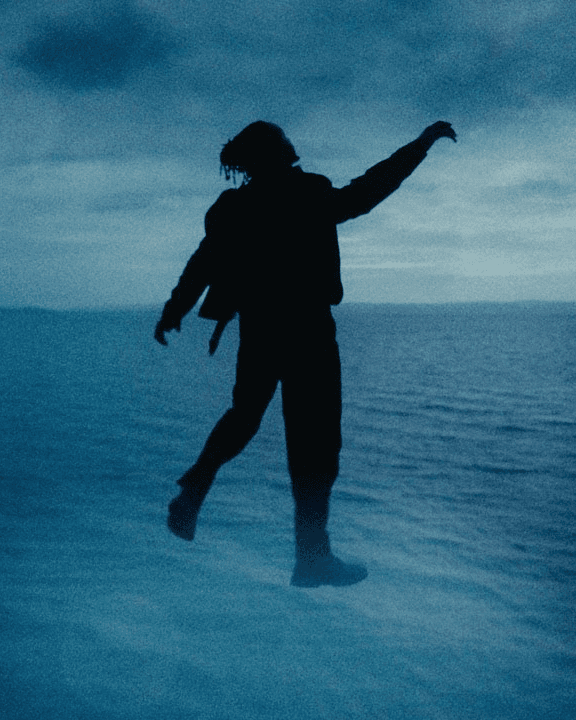 Man floating over the sea