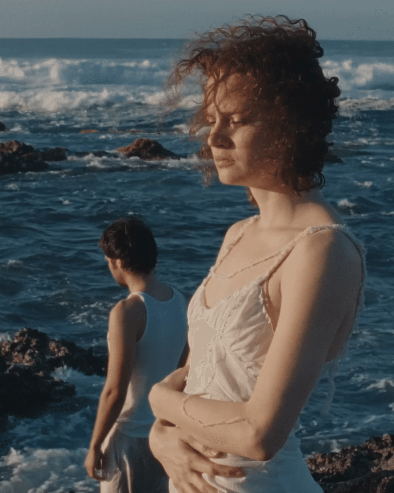 A Man and a Woman standing in the sea