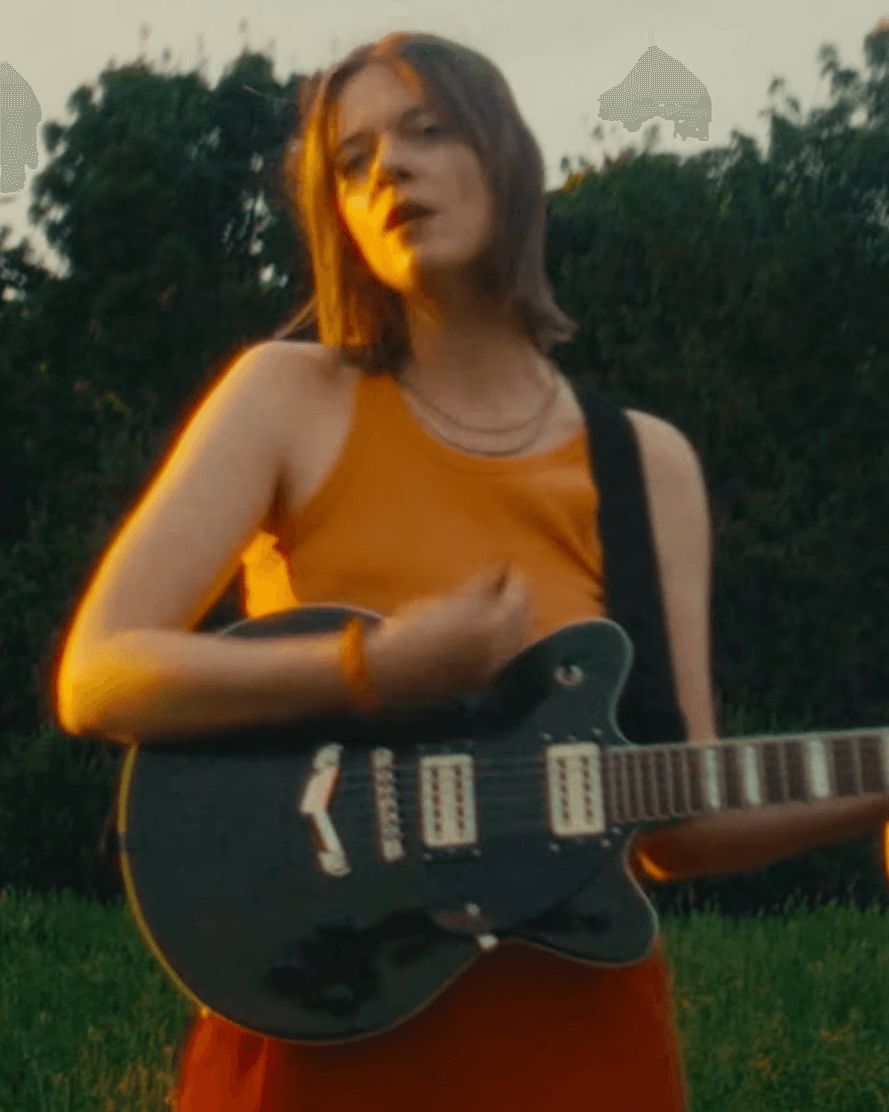 A Woman playing a guitar