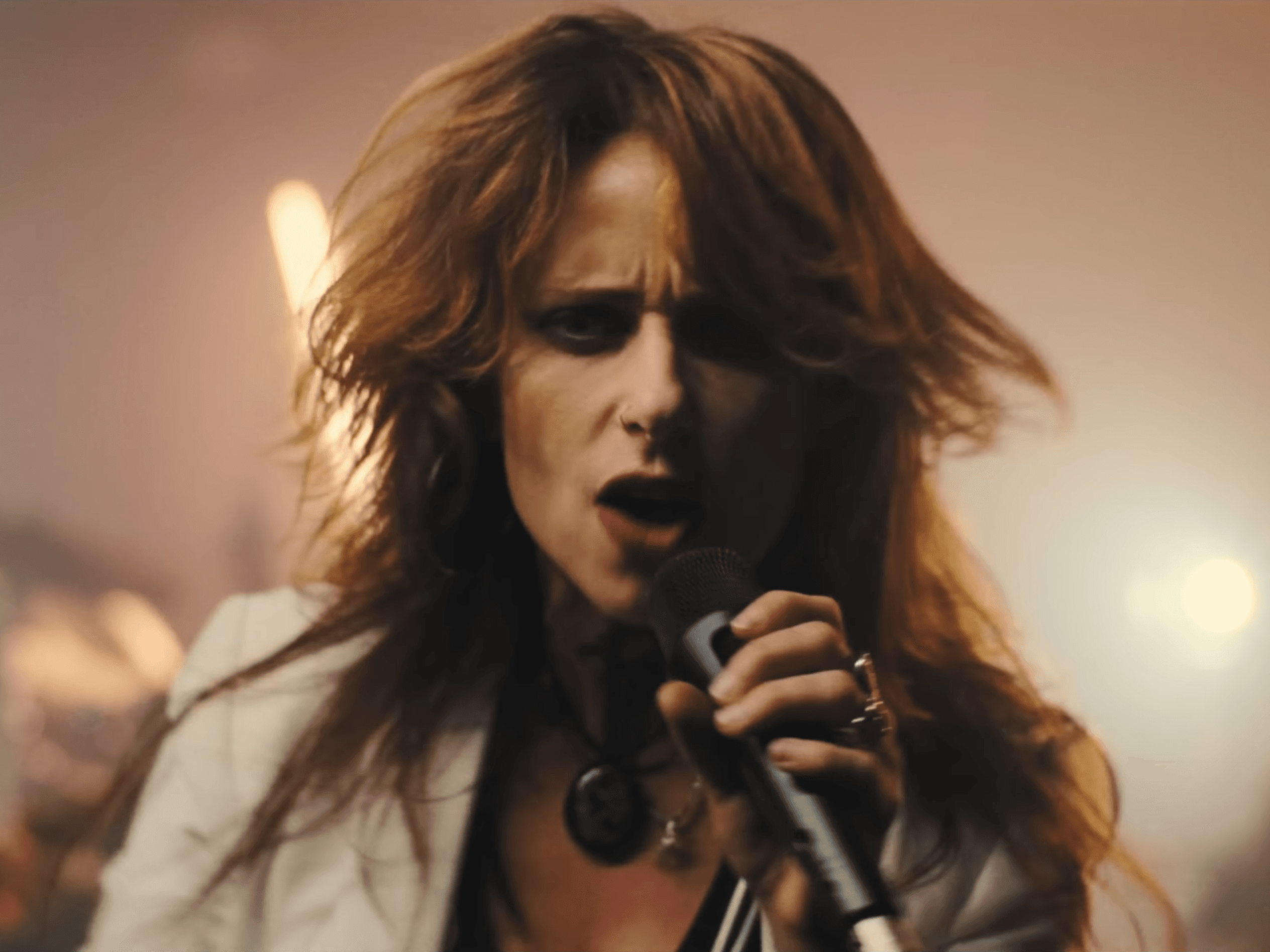 Woman singing into camera